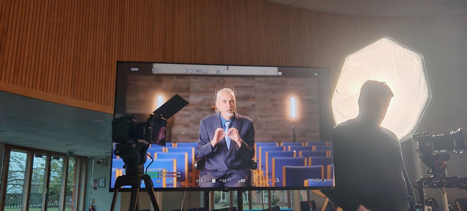Camera monitor filming in an auditorium