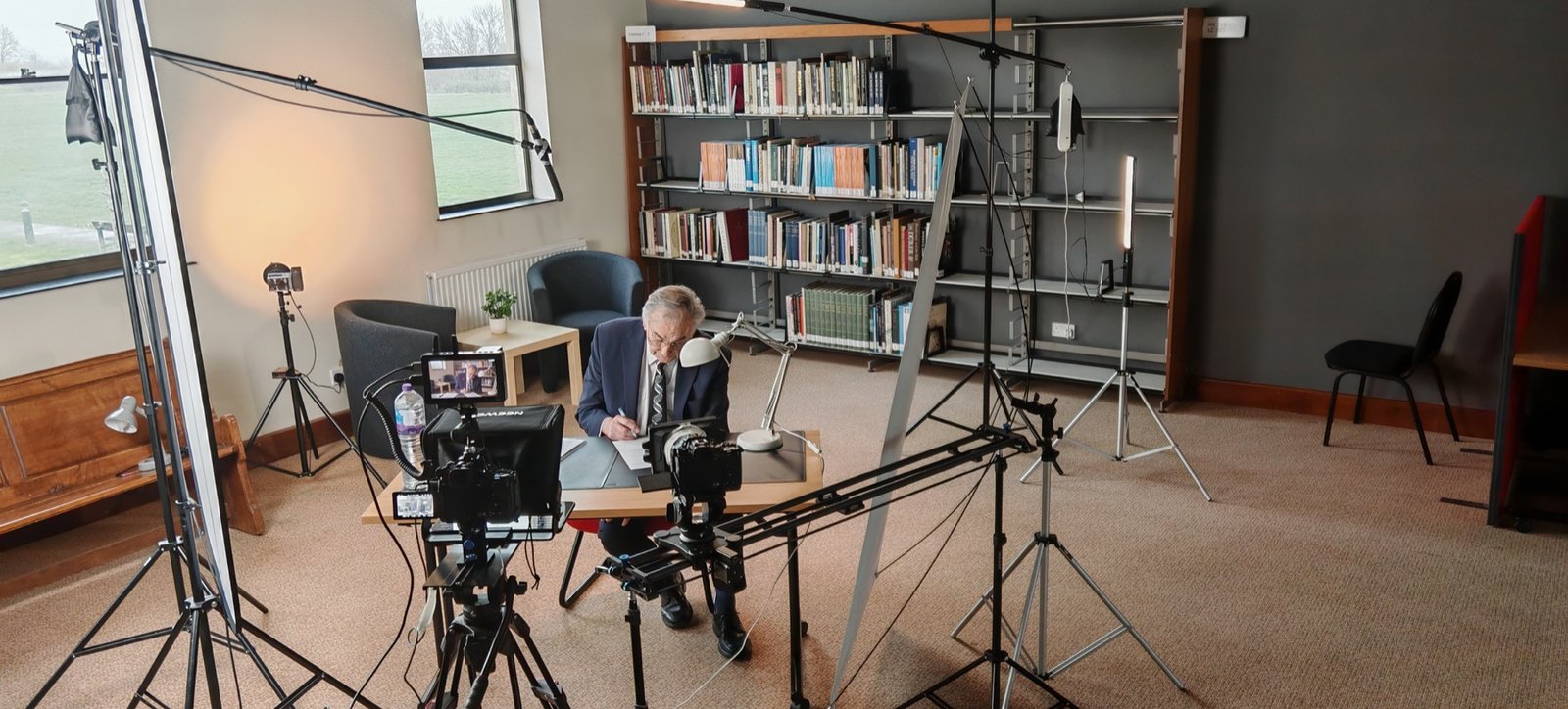 Behind the scenes filming for Newbold Connect in a library setting