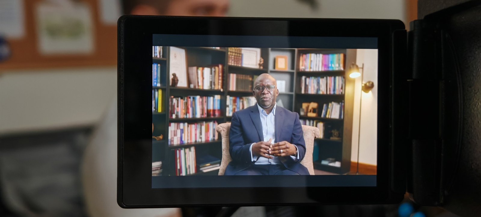 Camera monitor filming an interview in a library