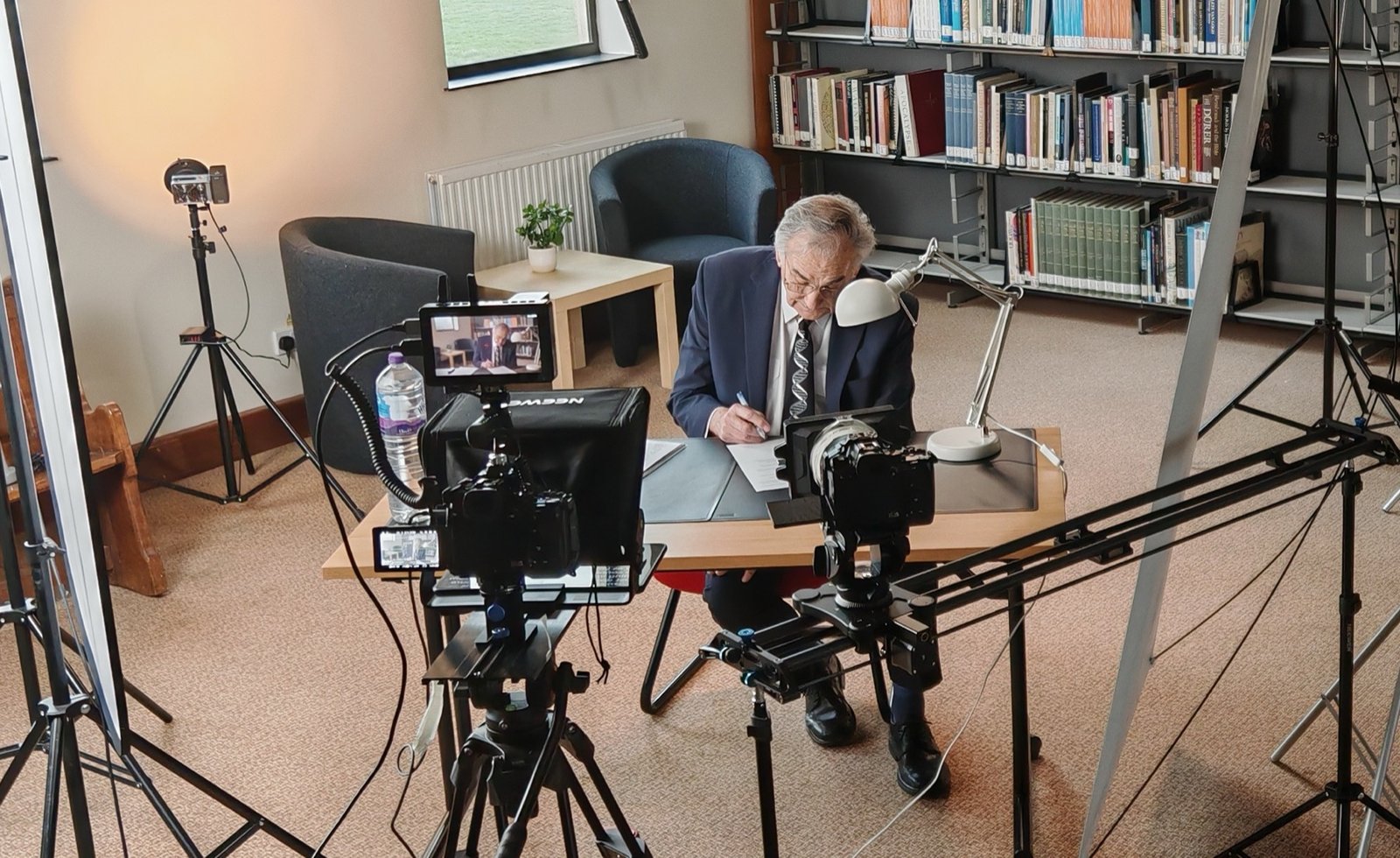 Behind the scenes filming for Newbold Connect in a library setting